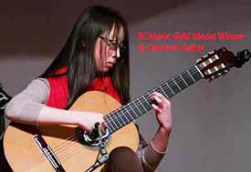 Guitar teacher Lynn Ware winning student Jessica Gu winner of the Gold Medal in Classical Guitar and the North Yourk Music Festivel Best Guitarist trophy